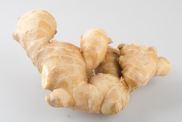 Ginger or fresh ginger on a background.
