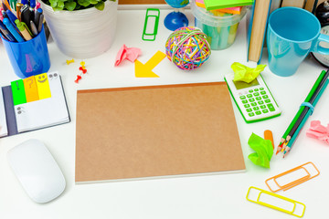 Work place of a creative person with a variety of colorful stationery objects