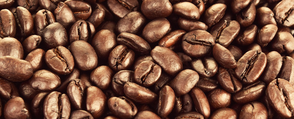 Closeup of roasted coffee beans, a background