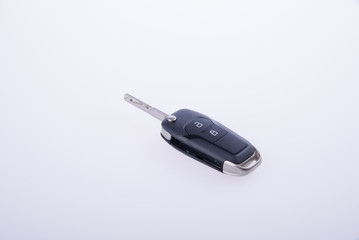 key or car key with remote on background.