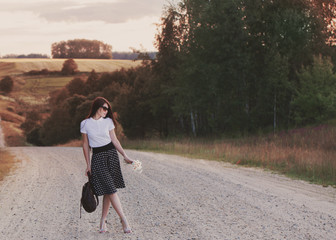 girl with flowers on road