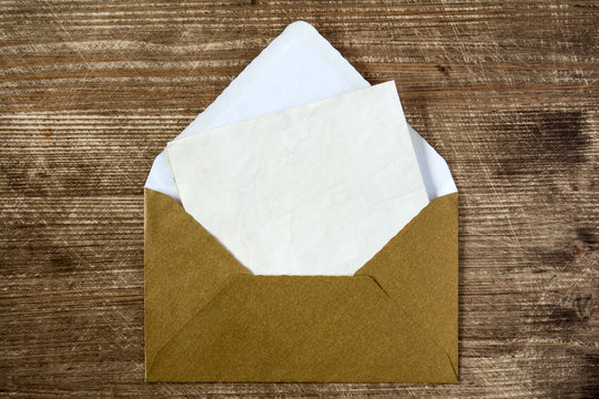 Golden envelope with blank letter