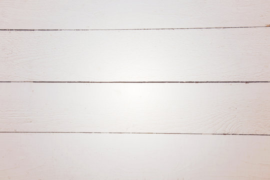 White wooden board background with horizontal lines.