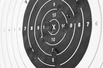Naklejka premium Holes in a shooting practice target. Target With Hits.