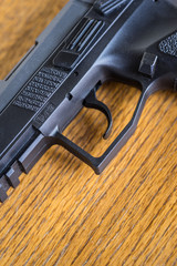 Macro shot of handgun. Close up view of pistol part.