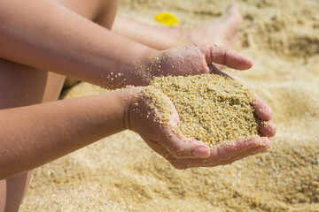 Sand in the Woman Hands
