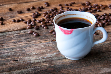 Red lipstick on a cup of coffee. Copyspace