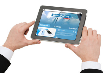 close up of hands with business news on tablet pc