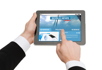 close up of hands with business news on tablet pc