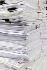 Stack of business papers isolated on white background