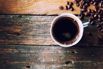 Steaming coffee with freshly ground beans. Top view. Copyspace