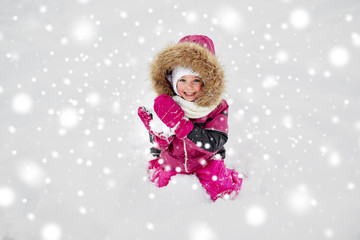 Fototapeta na wymiar f happy little child or girl with snow in winter