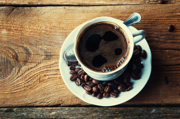 Steaming coffee with freshly ground beans. Top view. Copyspace