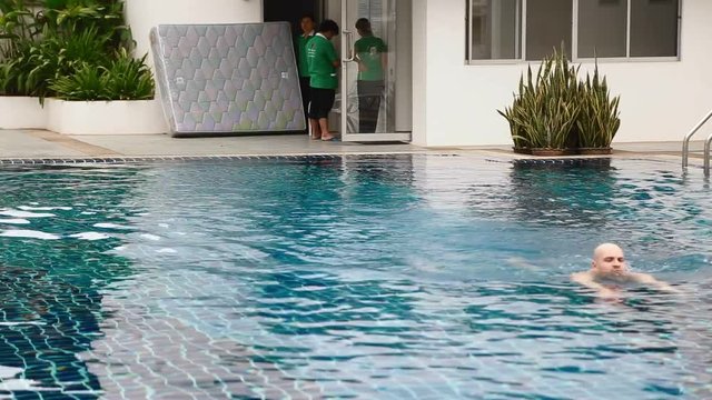 Fit Bald caucasion man at pool