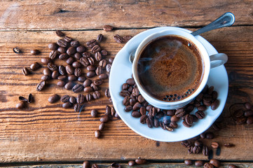 Cup of coffee with freshly ground beans. Top view. Copyspace