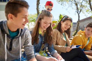 group of students with notebooks at school yard