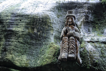 Fototapeta na wymiar Wooden statue of the water spirit