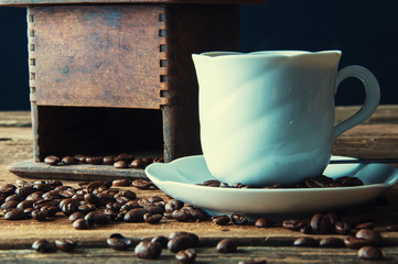 Cup of coffee with freshly ground beans