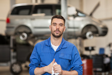 auto mechanic man or smith at car workshop