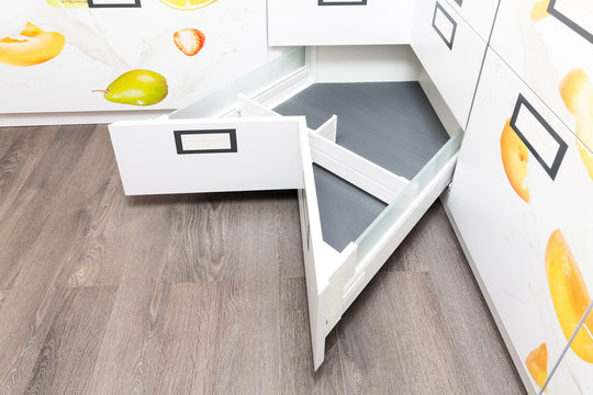 Opened angled drawer with organizer, ideal solution for corner cupboards 