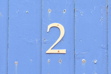 House Number 2 sign on gate