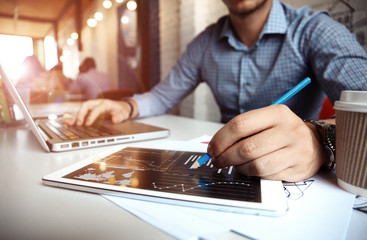 Business adviser analyzing financial figures denoting the progress in the work of company