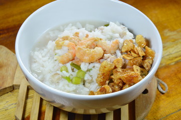 rice porridge with minced pork and dried shrimp topping fried garlic on bowl