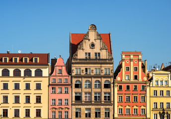 Fototapeta premium Wroclaw city center. Row of colorful retro buildings on Market square. tenements and apartment for rent. Wroclaw, Poland