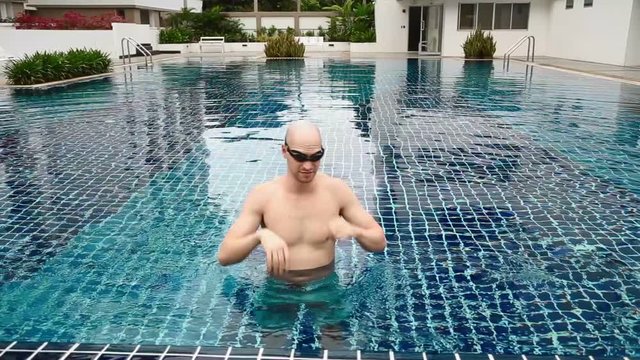 Fit Bald caucasion man at pool