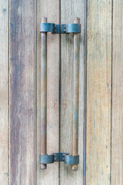 old wooden entrance door with antique door handle
