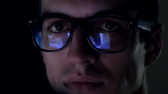 man watching nude content on internet reflection on glasses