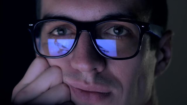 man watching nude content on internet reflection on glasses