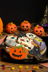 Creepy Halloween cookies and pumpkin baskets filled with candies