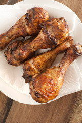 Close up on four roasted drumsticks