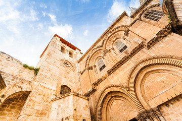 Fototapeta premium Entrance to the Church of the Holy Sepulchre. Patio and the main facade. Jerusalem, Israel.