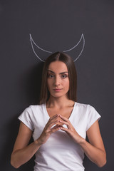 Girl showing devil