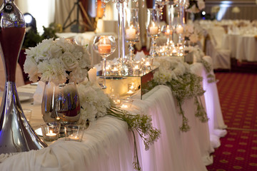 luxury decorated main table in the wedding hall