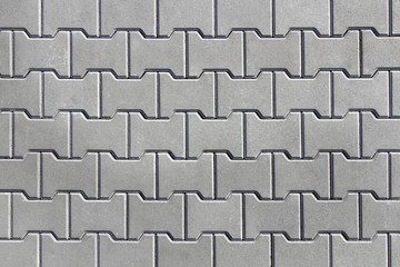 Urban street covered with gray concrete elements