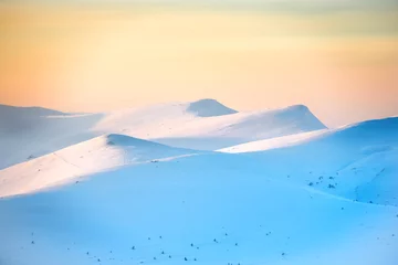 Foto op Plexiglas Sunset over hills with snow © Pavlo Vakhrushev