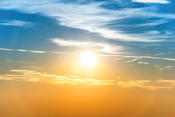 Sunset in the sky with blue orange clouds