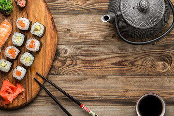 Obraz na płótnie Canvas Closeup of rolls with soy sauce, top view