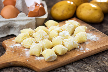 Uncooked homemade gnocchi on  cutting board