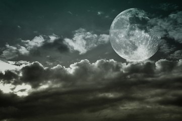 Vintage cloudy sky with full moon.