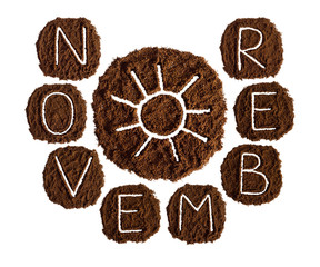 November and sun, decorated with ground coffee on white background