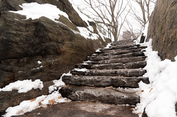 Snowy stone park stairs