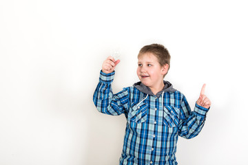 Smiling child holding tablet PC in hands. Idea concept. Photo sh