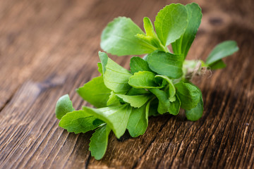 Vintage wooden table with Stevia leaves