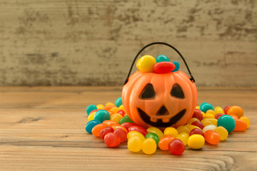 Halloween pumpkin basket full of candies