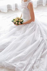 Obraz na płótnie Canvas Bride in beautiful dress with wedding bouquet