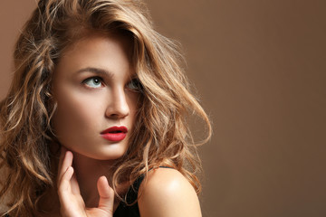 Fototapeta premium Portrait of beautiful young woman on color background
